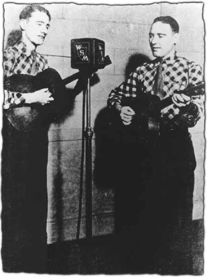 Two musicians perform into a vintage microphone, wearing plaid shirts, showcasing the early days of radio broadcasting.